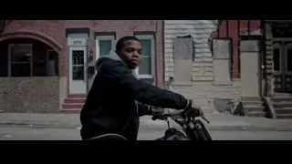 Young man riding motorcycle on street — Creed