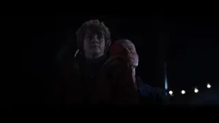 two men standing in dark room — Iron Man 3