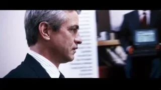 middle-aged man in dark suit serious expression — Jobs