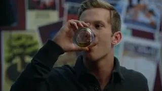 young man drinking whiskey in a room — Suits