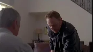 Man standing in living room with staircase — Breaking Bad