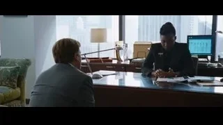man and woman conversing in office with city view — The Big Short