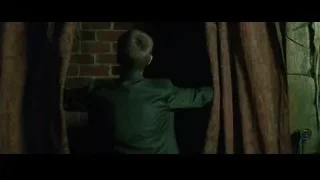 Man in suit by red curtain — The Matrix