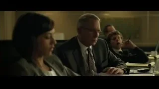 three people sitting at office desk — The Social Network