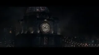 Lit clock tower at night with city skyline — The Amazing Spider Man 2