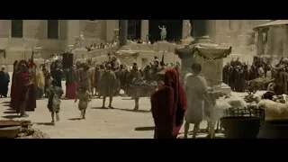 people standing in line with cityscape background — Gladiator 2