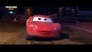 Lightning McQueen parked at motel at night — Cars