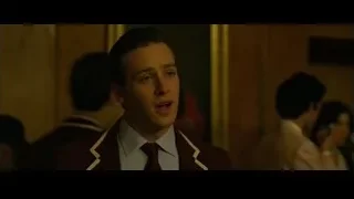 Young man in suit in room with mirror — The Social Network