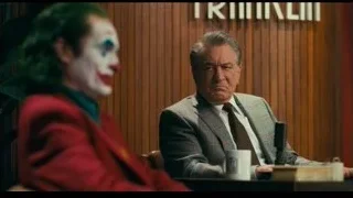 Joker and man at a table — Joker