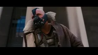 man in mask holding gun — Batman: The Dark Knight Rises