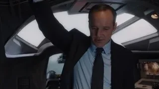 man in suit in control room — The Avengers