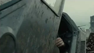 man sitting in old rusted car — Blade Runner 2049