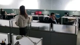 two people talking in office cubicle — Suits