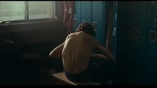 Shirtless man in blue locker room — Joker