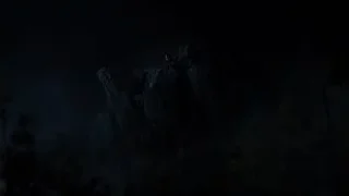 man sitting on rocky cliff at night — The Avengers