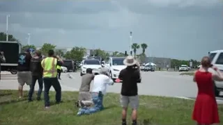 people gathered around white SUV — Elon Musk: Return to Space