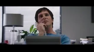 man talking on phone at desk — The Big Short