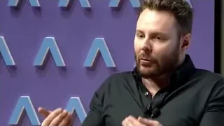 man speaking against purple background — Screened Out