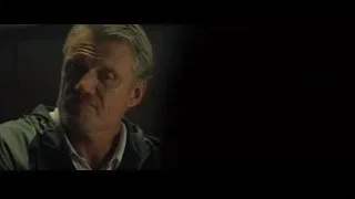 elderly man with beard in dimly lit room — Creed 2