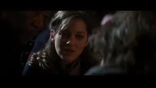 Woman in distress with man in dark room — Batman: The Dark Knight Rises
