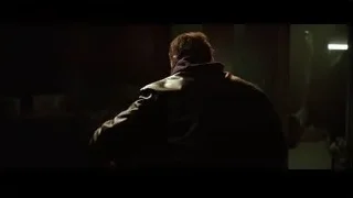 person in dimly lit room — Batman