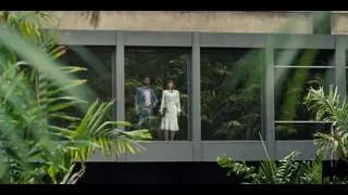 Man and woman looking at tropical garden view — Jurassic World