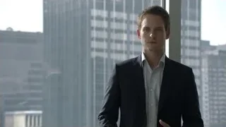 young man in suit by city skyline — Suits