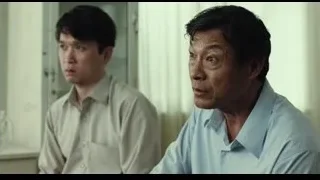 Two men talking in room with window — Life of Pi