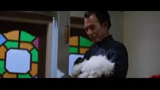 Man holding white dog by stained glass window — Bruce Lee: Enter The Dragon