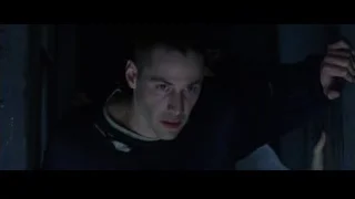 young man peeking from dark doorway — The Matrix