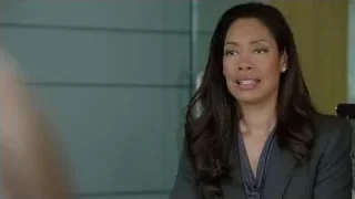 Woman in grey blazer speaking — Suits