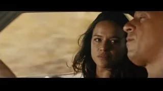 man and woman in car in desert — Furious Seven