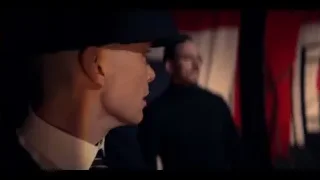 Two men in suits in dimly lit room — Peaky Blinders