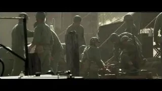 soldiers carrying wounded on stretcher — Hacksaw Ridge