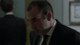 Man in suit walking towards door — Suits