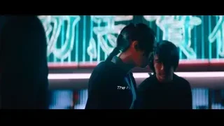 Two men in front of neon Chinese sign — John Wick: Chapter 4