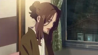 Young woman looking out window with green curtains — Your Name