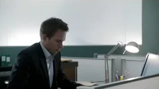 Man in suit at office desk with computer — Suits