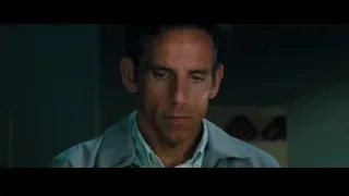 Man looking at camera in dimly lit room — The Secret Life of Walter Mitty