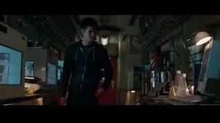 young man looking at computer in laboratory — The Amazing Spider Man 2