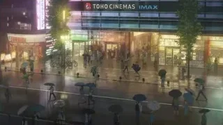 Busy Tokyo street at night with cinema sign — Weathering with You