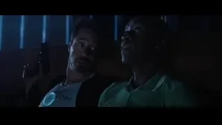 Two men with guns in dark room — Iron Man 3