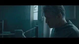 man in dimly lit room with tools — Creed 2