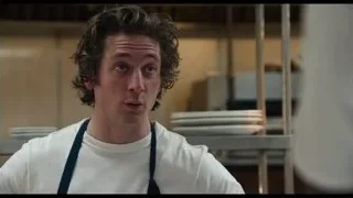 young man in blue apron in kitchen — The Bear