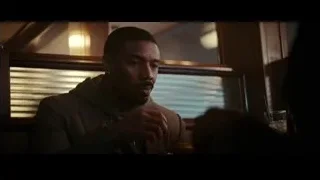 Man sitting at table in restaurant — Creed 3