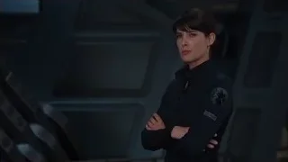 woman in black uniform in futuristic space station — The Avengers