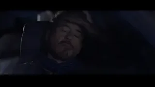man in car with head resting on hand — Iron Man 3