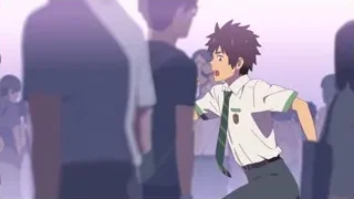 young man in school uniform in front of crowd — Your Name