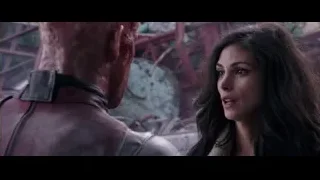 woman and man in red jacket in rubble — Deadpool