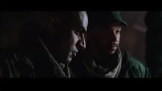 two men facing each other in dark room — Iron Man